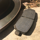 One of the old rotors and pads had matching divots in them.